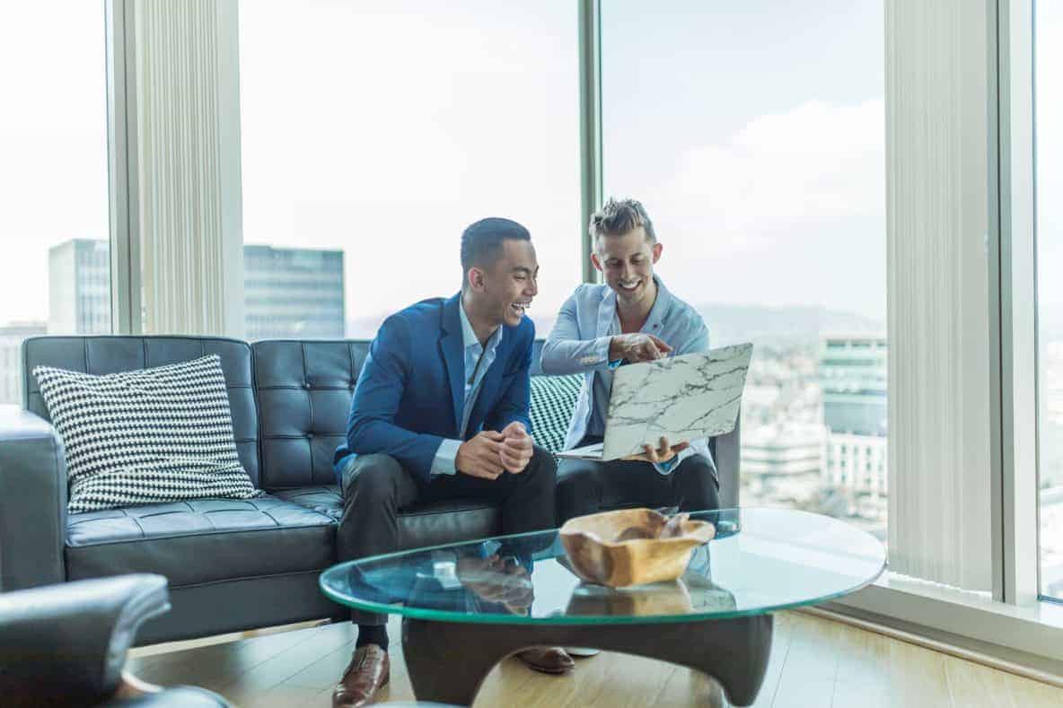 Leadership coaching. Two business men at laptop