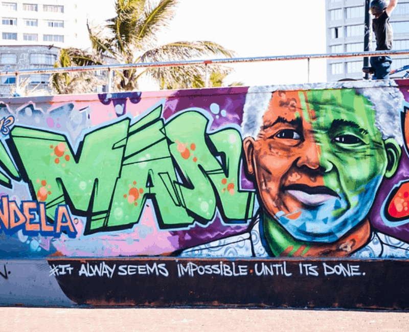 Great Leadership. Picture of wall grafitti with Mandela's face and quote.